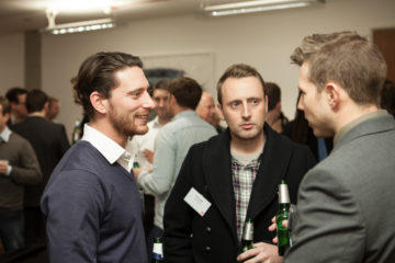 Young Professionals Networking Outside Their Company